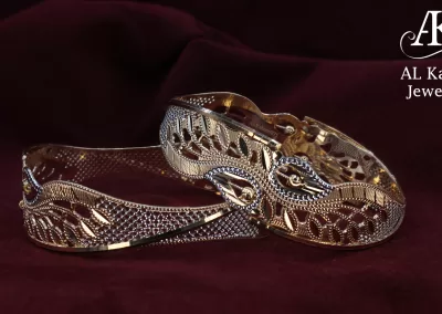 Elegant handcrafted gold bangles with intricate leaf and mesh design by Al Kabeer Jewellers"Elegant handcrafted gold bangles with intricate leaf and mesh design by Al Kabeer Jewellers"